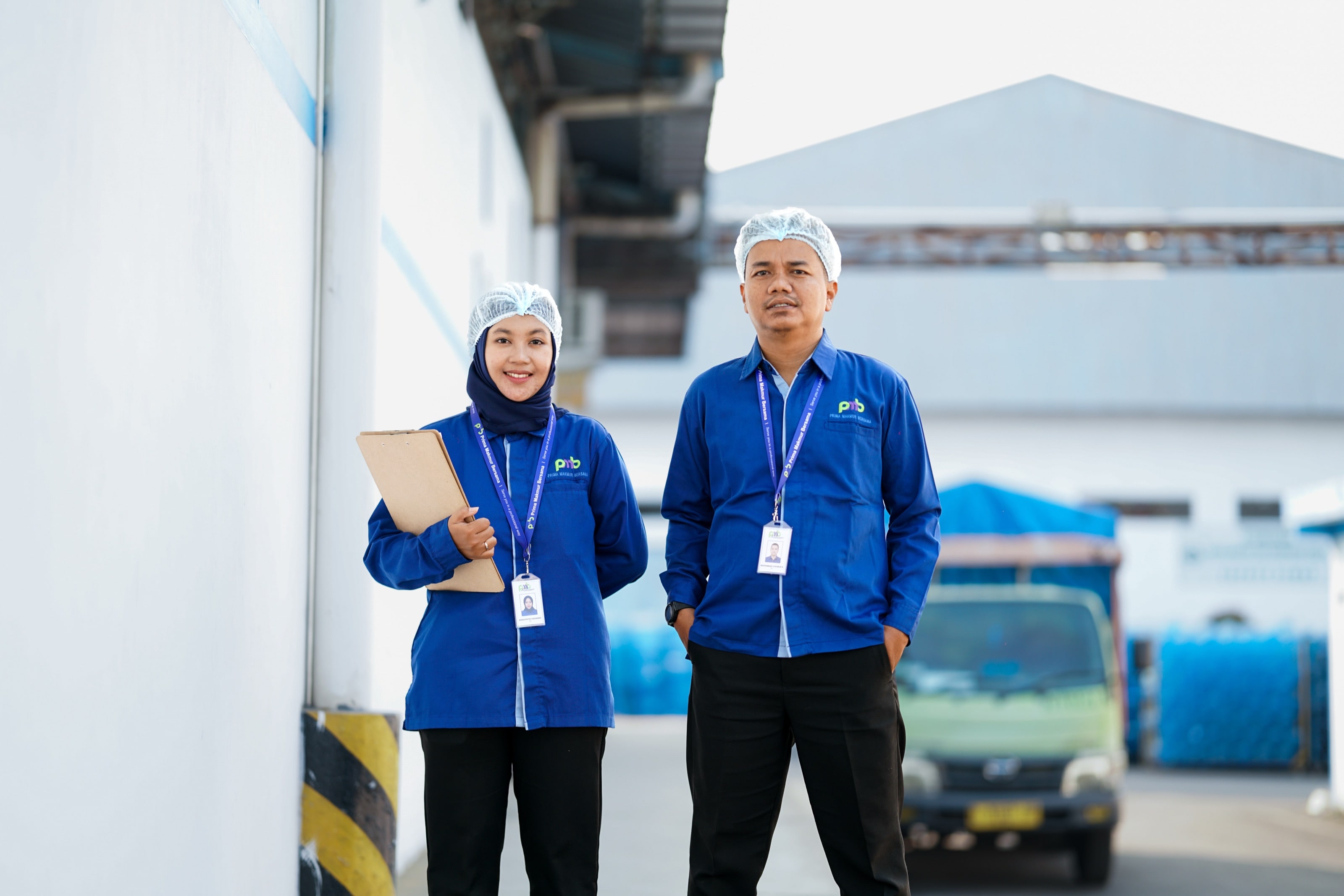 Two PMB coordinators in uniform at a partner facility